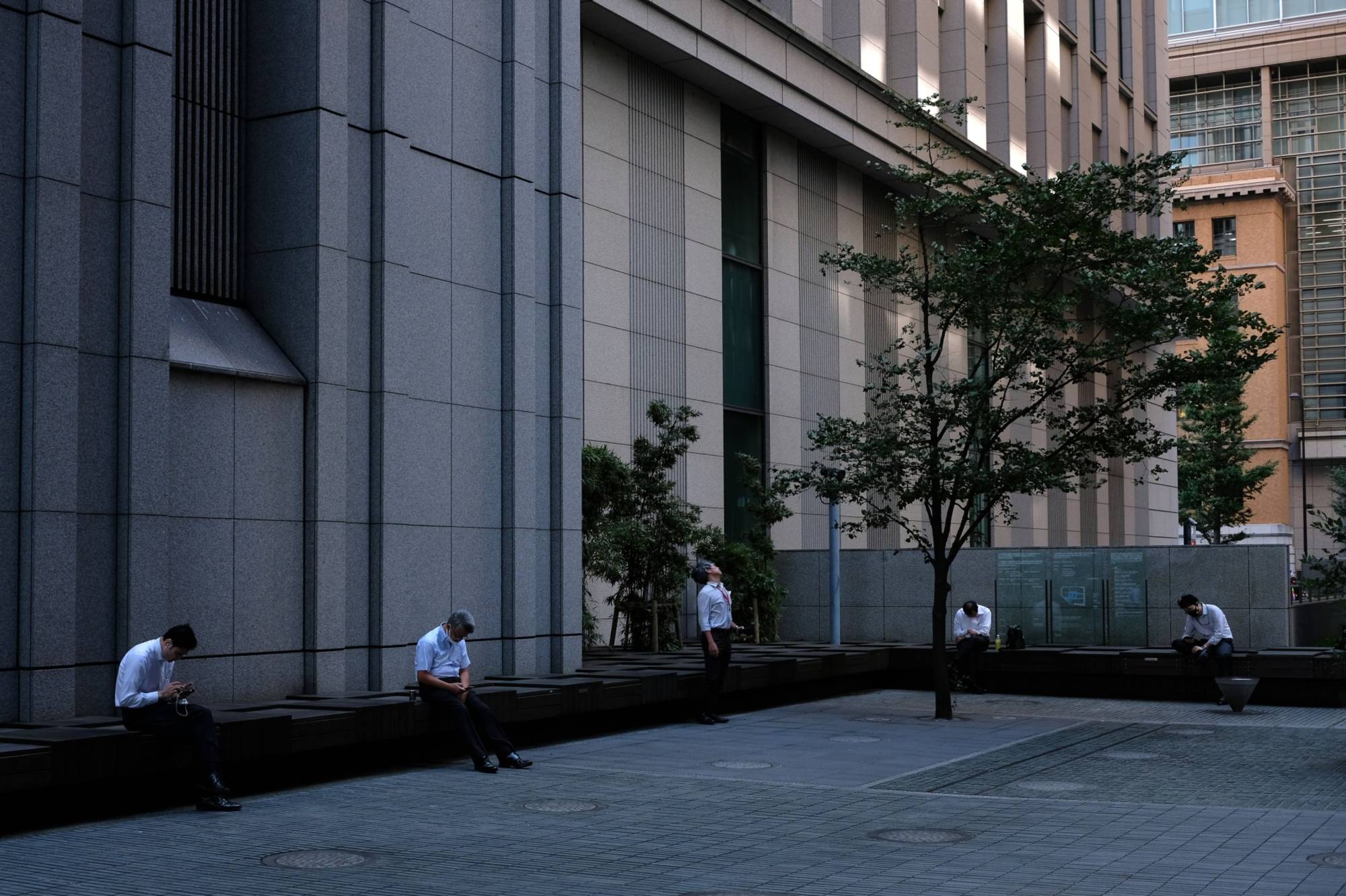 Japan is considering creating a one-stop venue where financial firms can file regulatory paperwork in English. | BLOOMBERG