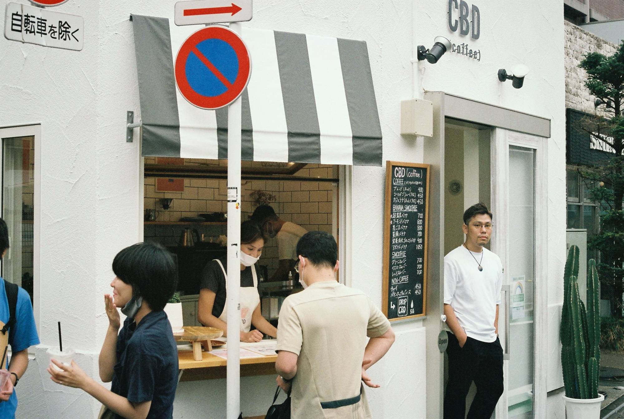 A place for calm: Kota Shimomura stands in the doorway of CBD Coffee, where he sells CBD-infused coffee and smoothies. | DAN BUYANOVSKY