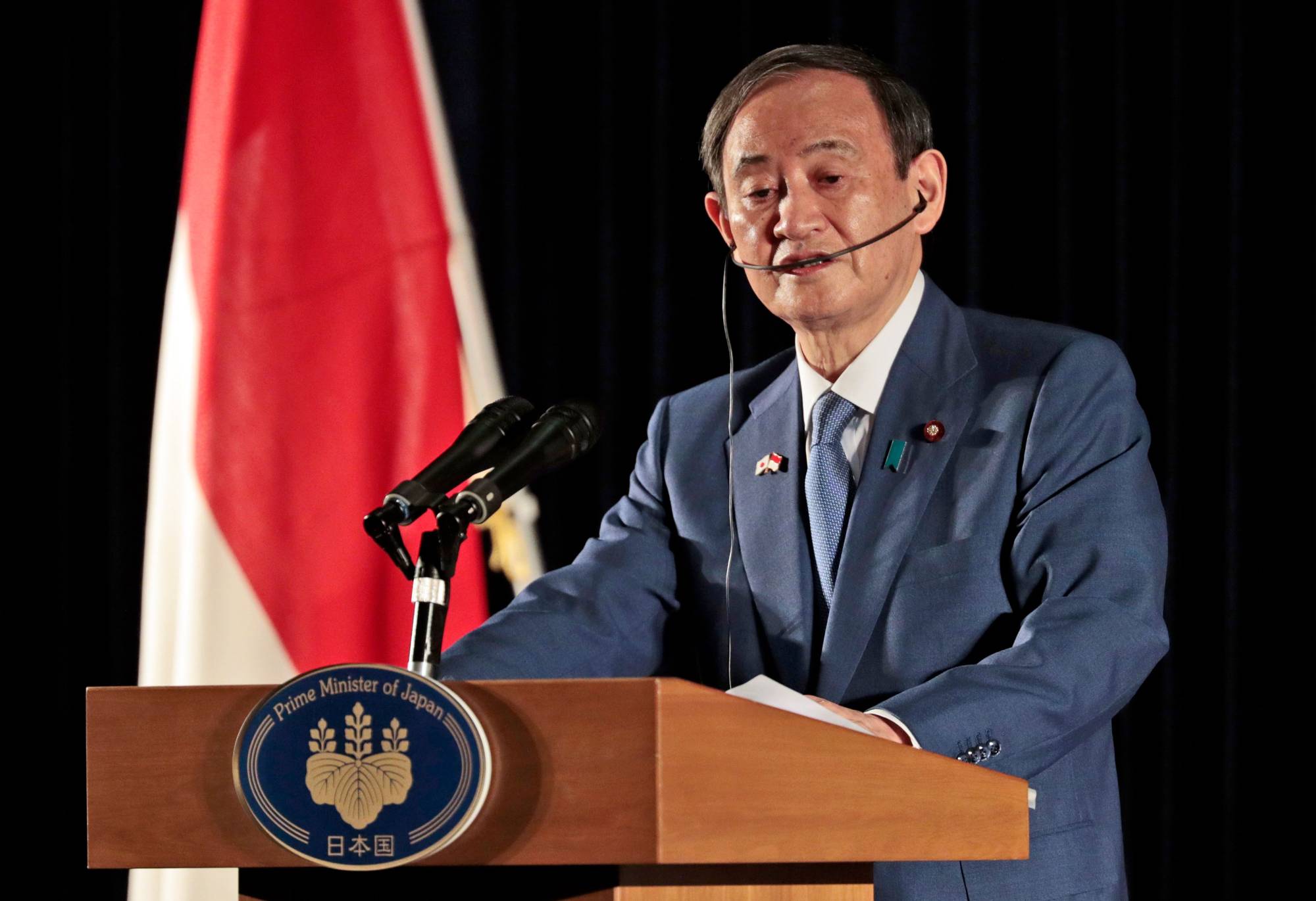 Prime Minister Yoshihide Suga addresses the media during a news conference in Jakarta on Wednesday. | AFP-JIJI