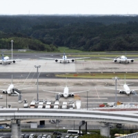 Narita International Airport Co. will waive landing and parking charges for all domestic flights, while reducing the amount for international flights, to help airlines. | KYODO
