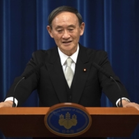 Prime Minister Yoshihide Suga speaks during a news conference in Tokyo on Sept. 16. | POOL / VIA AP