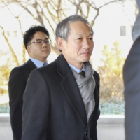 Shigeki Takizaki enters South Korea\'s Foreign Ministry building in Seoul in February. | KYODO
