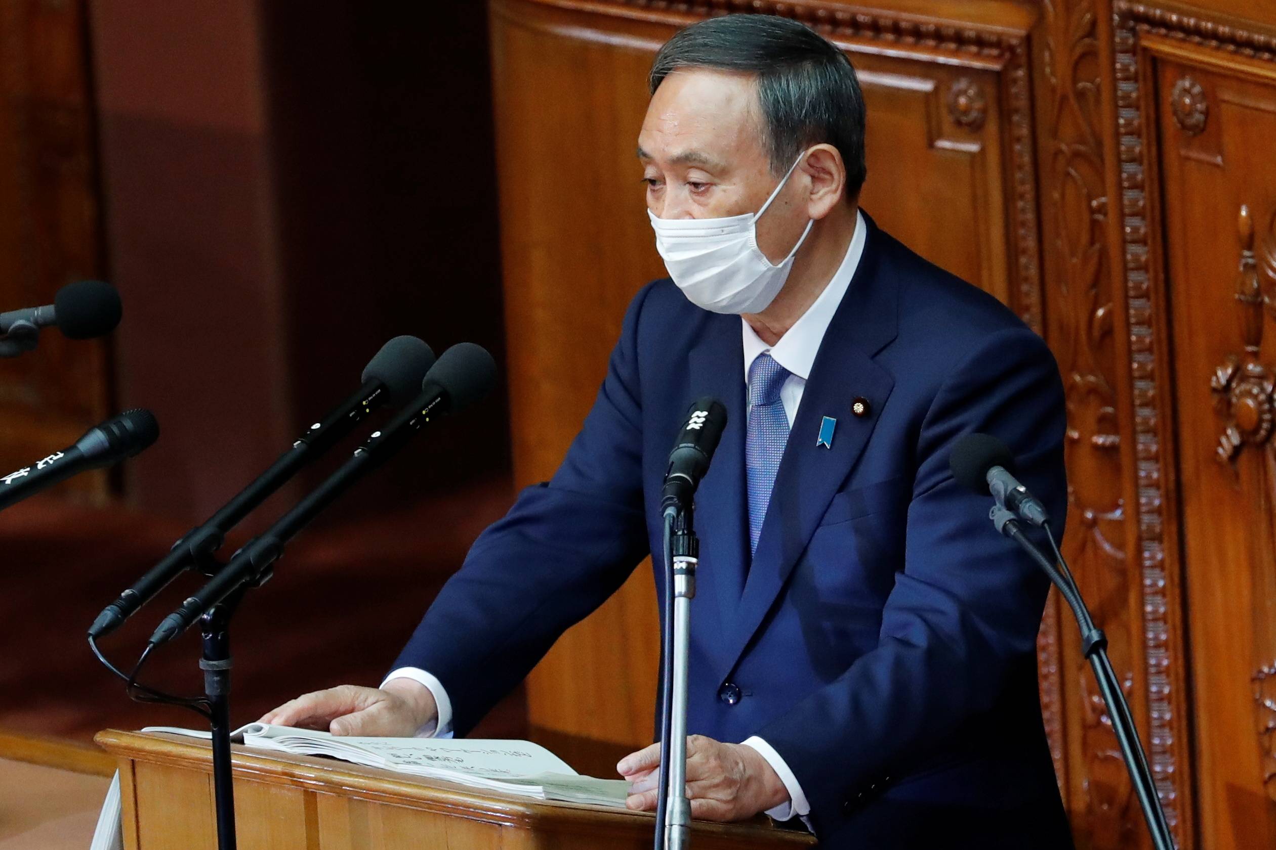 Prime Minister Yoshihide Suga gives his first policy speech in the Diet on Monday. In the speech, he set a goal of cutting greenhouse gas emissions to net zero by 2050. |  REUTERS