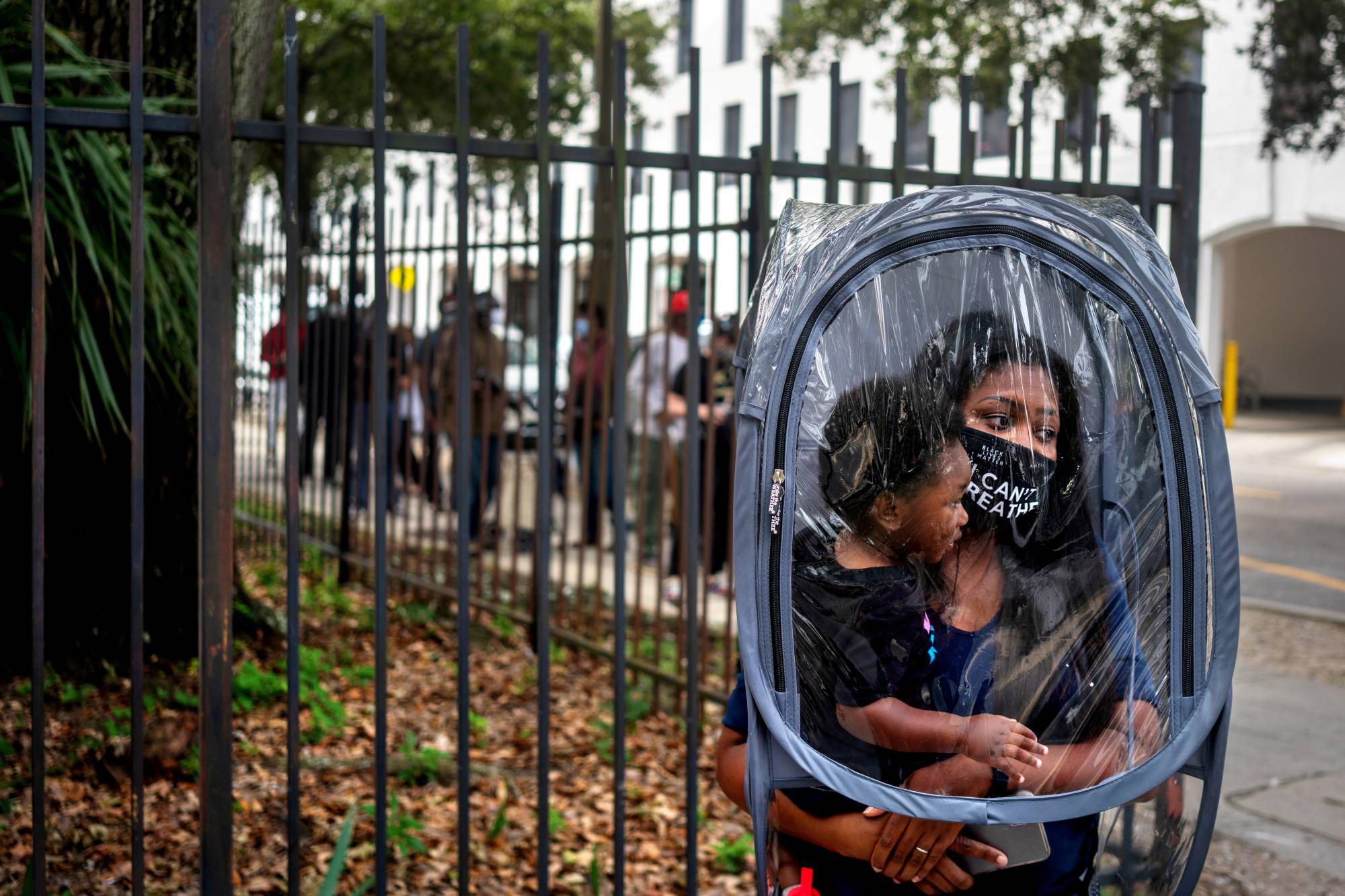 A woman and her son wait in line to vote in New Orleans, Louisiana, earlier this month. | REUTERS