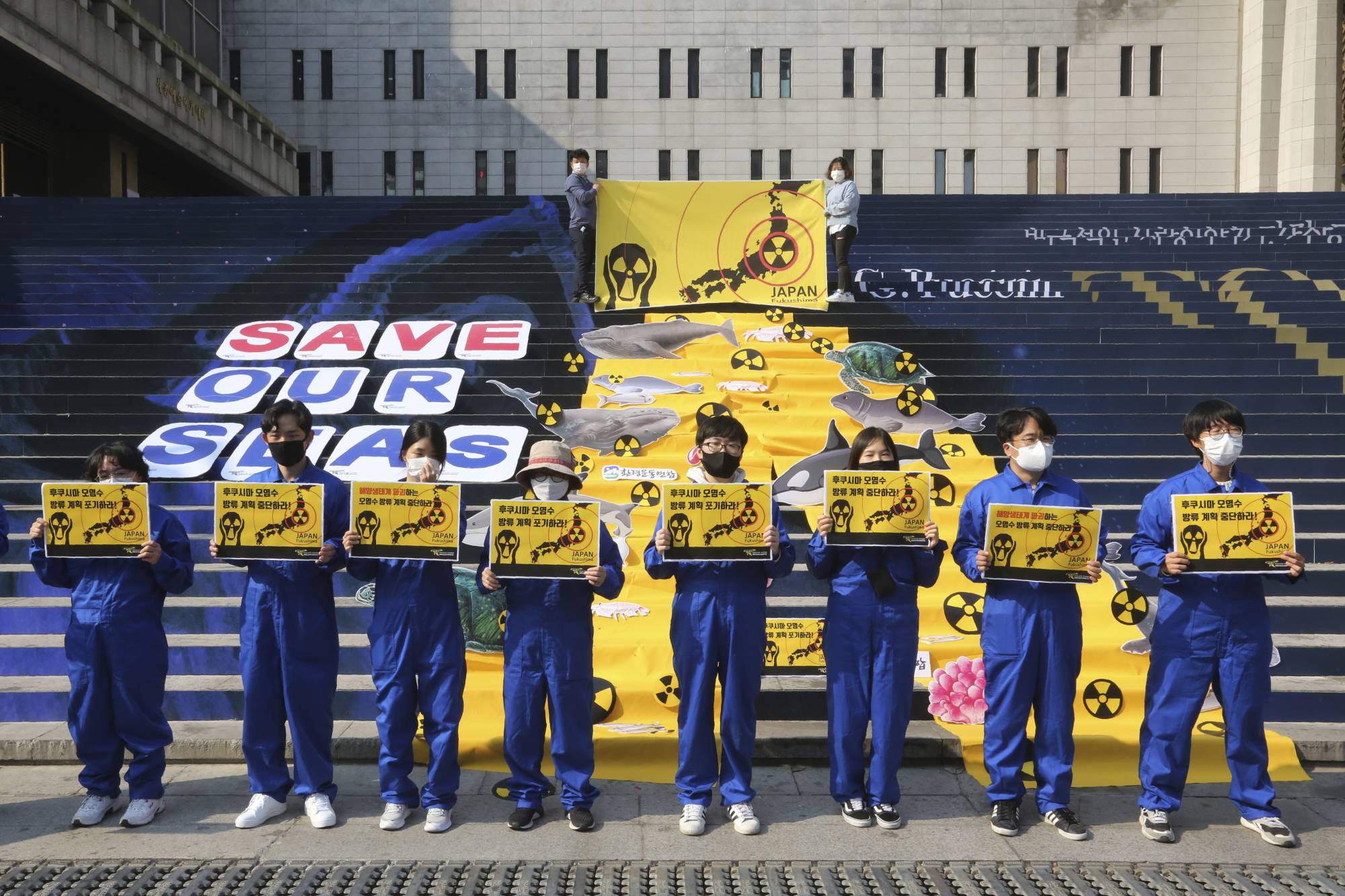 South Korean environmentalists stage a rally against Japan's disposal of radioactive water plan at the Fukushima nuclear power, in Seoul on Oct. 26. | AP