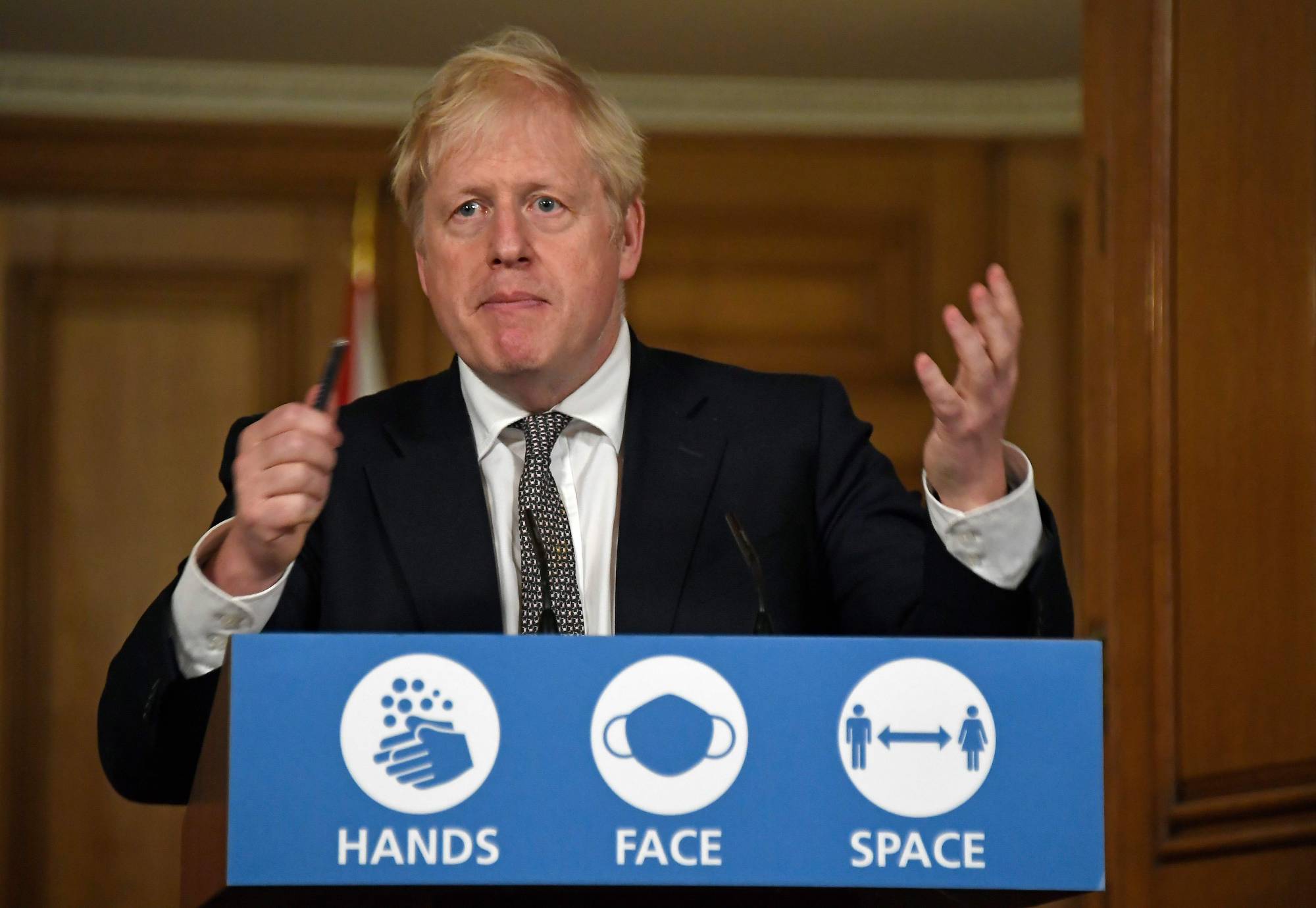 U.K. Prime Minister Boris Johnson speaks during a virtual news conference on Saturday to announce new lockdown restrictions in an effort to curb rising infections of the novel coronavirus.  | POOL / VIA AFP-JIJI