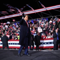 U.S. President Donald Trump waves as he departs a rally at Williamsport Regional Airport in Montoursville, Pennsylvania, on Saturday. | AFP-JIJI