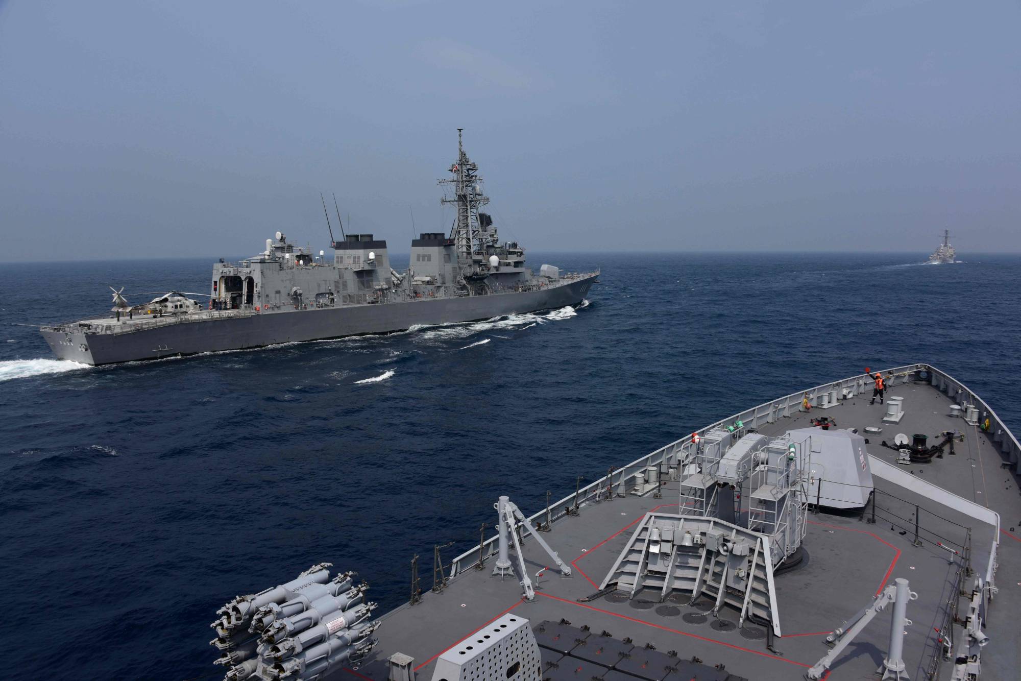 Naval vessels take part in the Malabar exercise in the Bay of Bengal on Tuesday. | INDIAN NAVY / VIA AFP-JIJI