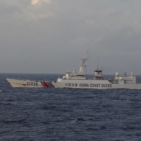 China will allow its coast guard to use weapons when foreign ships involved in illegal activities in waters it controls fail to obey orders, such as to stop, a bill unveiled by a body of the country\'s parliament showed Wednesday. | 11TH REGIONAL COAST GUARD HEADQUARTERS-JAPAN COAST GUARD / VIA REUTERS