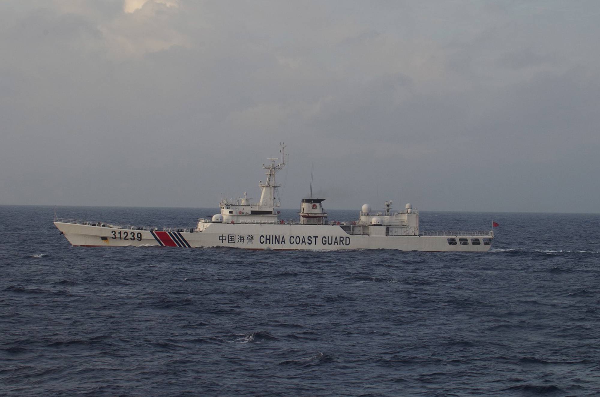 China will allow its coast guard to use weapons when foreign ships involved in illegal activities in waters it controls fail to obey orders, such as to stop, a bill unveiled by a body of the country's parliament showed Wednesday. | 11TH REGIONAL COAST GUARD HEADQUARTERS-JAPAN COAST GUARD / VIA REUTERS