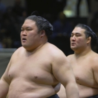 Signs of strength: Director Eiji Sakata sought to portray sumo wrestlers as \"supermen\" in his documentary, \"Sumodo: The Successors of Samurai.\" | © 2020 \"SUMODO: THE SUCCESSORS OF SAMURAI” FILM PARTNERS
