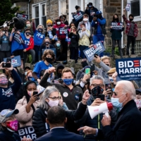 Joe Biden speaks to people on Election Day in the West Oak Lane neighborhood of Philadelphia,  | ERIN SCHAFF / THE NEW YORK TIMES