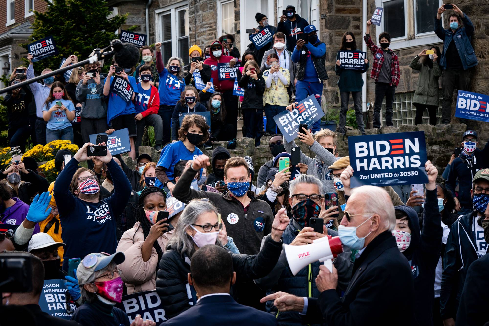 Joe Biden speaks to people on Election Day in the West Oak Lane neighborhood of Philadelphia, | ERIN SCHAFF / THE NEW YORK TIMES