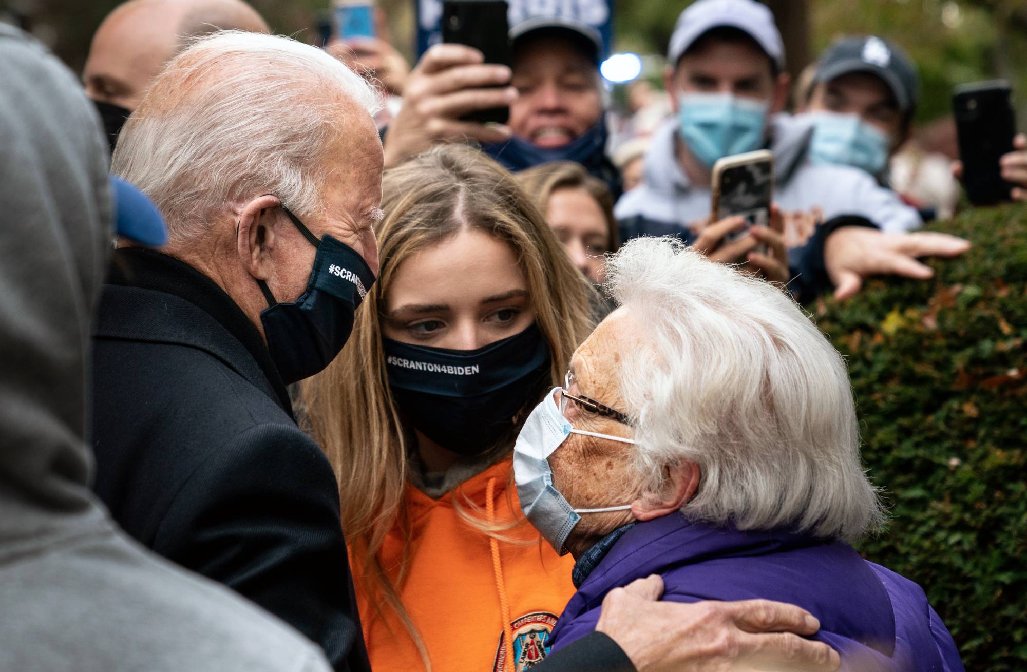 Former Vice President Joe Biden chats with a supporter as visits his childhood home in Scranton, Pa., on Election Day morning. | ERIN SCHAFF / THE NEW YORK TIMES