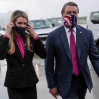 Kelly Loeffler and David Perdue, Republican senators from Georgia, at Hartsfield-Jackson Atlanta International Airport following the arrival of President Donald Trump in Atlanta in July 2020 | REUTERS