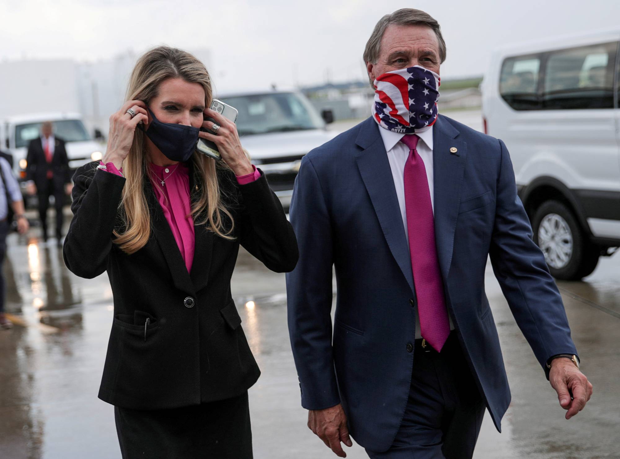 Kelly Loeffler and David Perdue, Republican senators from Georgia, at Hartsfield-Jackson Atlanta International Airport following the arrival of President Donald Trump in Atlanta in July 2020 | REUTERS