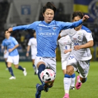 Yokohama FC striker Koki Saito attacks the Oita goal during the second half of a J. League first-division game on Tuesday in Yokohama. | KYODO