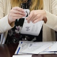 A Luzerne County worker canvases ballots as vote-counting in the general election continues, Friday in Wilkes-Barre, Pennsylvania. | AP