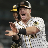 The Tigers\' Justin Bour celebrates after hitting a home run against the Giants at Koshien Stadium in Nishinomiya, Hyogo Prefecture, on July 9. | KYODO
