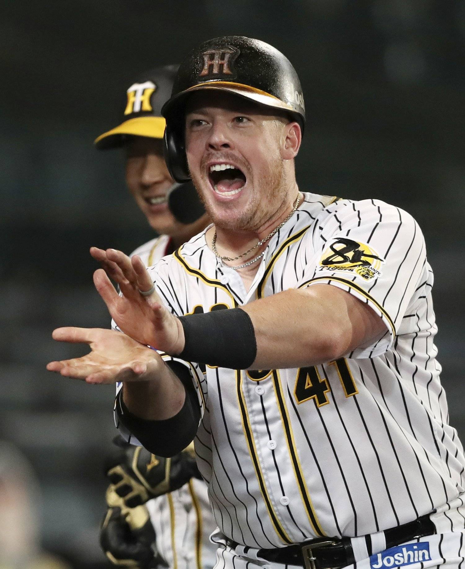 The Tigers' Justin Bour celebrates after hitting a home run against the Giants at Koshien Stadium in Nishinomiya, Hyogo Prefecture, on July 9. | KYODO