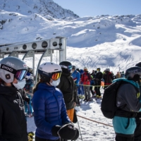 Skiers queue for the chairlift on the opening day of the Verbier ski area in the Swiss Alps on Oct. 30.  | KEYSTONE / VIA AP