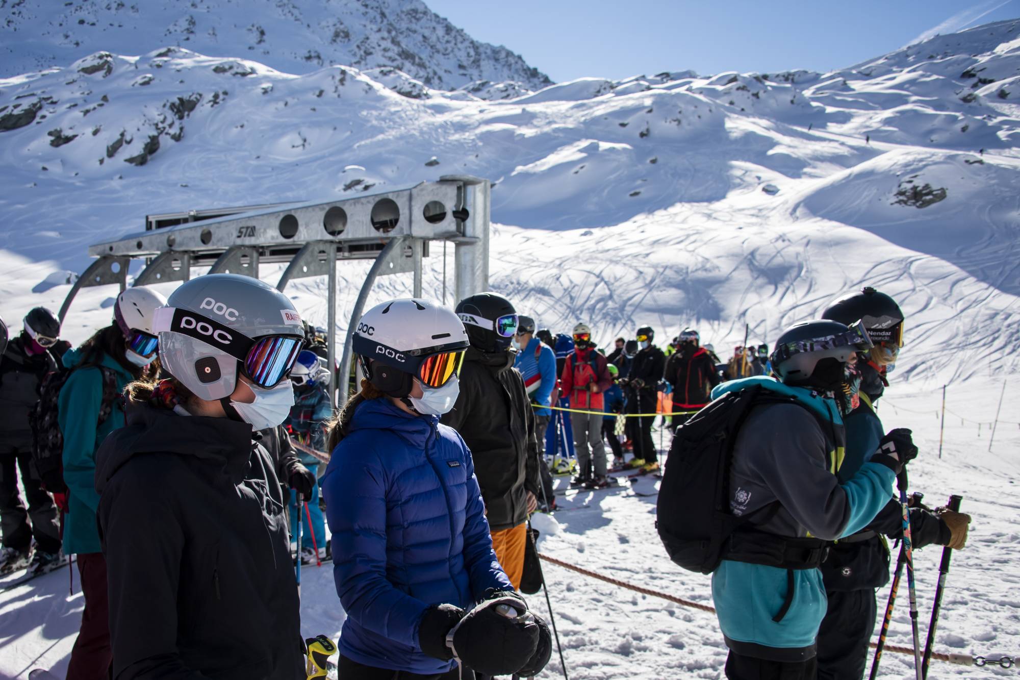 Skiers queue for the chairlift on the opening day of the Verbier ski area in the Swiss Alps on Oct. 30. | Keystone / via AP