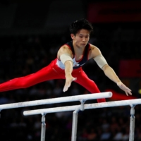 Kazuma Kaya competes in the men\'s parallel bars final during the 2019 World Artistic Gymnastics Championships in Stuttgart, Germany, on Oct. 13, 2019. | REUTERS
