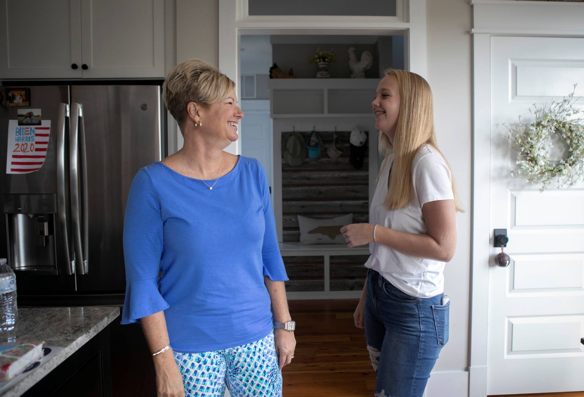 Joe Biden supporters Denise Armistead Auton, 46, and her daughter Hannah, 13, are at odds over politics with Denise's husband, Jeff. | REUTERS
