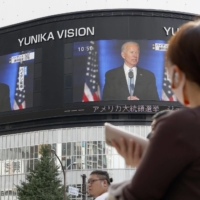 Large screens in Tokyo\'s Shinjuku Ward on Sunday show Joe Biden\'s speech as he declares victory in the U.S. presidential election. | KYODO