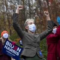 Female voters cheer during a speech from Jill Biden, U.S. President-elect Joe Biden\'s wife, in Westland, Michigan, on Oct. 29. | REUTERS