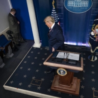 U.S. President Donald Trump leaves after making a statement at the White House on Thursday. | DOUG MILLS / THE NEW YORK TIMES