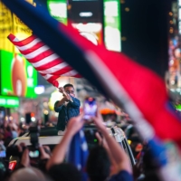 Supporters of Joe Biden gather in New York\'s Times Square to celebrate the news that he was elected the 46th president of the United States on Saturday. | CHANG W. LEE / THE NEW YORK TIMES