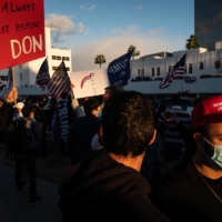 Supporters of President Donald Trump gather in Beverly Hills, California, on Saturday to protest the results of the presidential election. | RYAN CHRISTOPHER JONES / THE NEW YORK TIMES