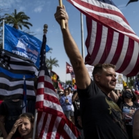 Trump supporters gather in Phoenix on Saturday.  | ADRIANA ZEHBRAUSKAS / THE NEW YORK TIMES