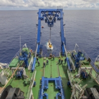 The submersible DSV Shinkai 6500, is lowered into the ocean during a cruise to observe the Suiyo Seamount. | CHONG CHEN / JAMSTEC / VIA THE NEW YORK TIMES