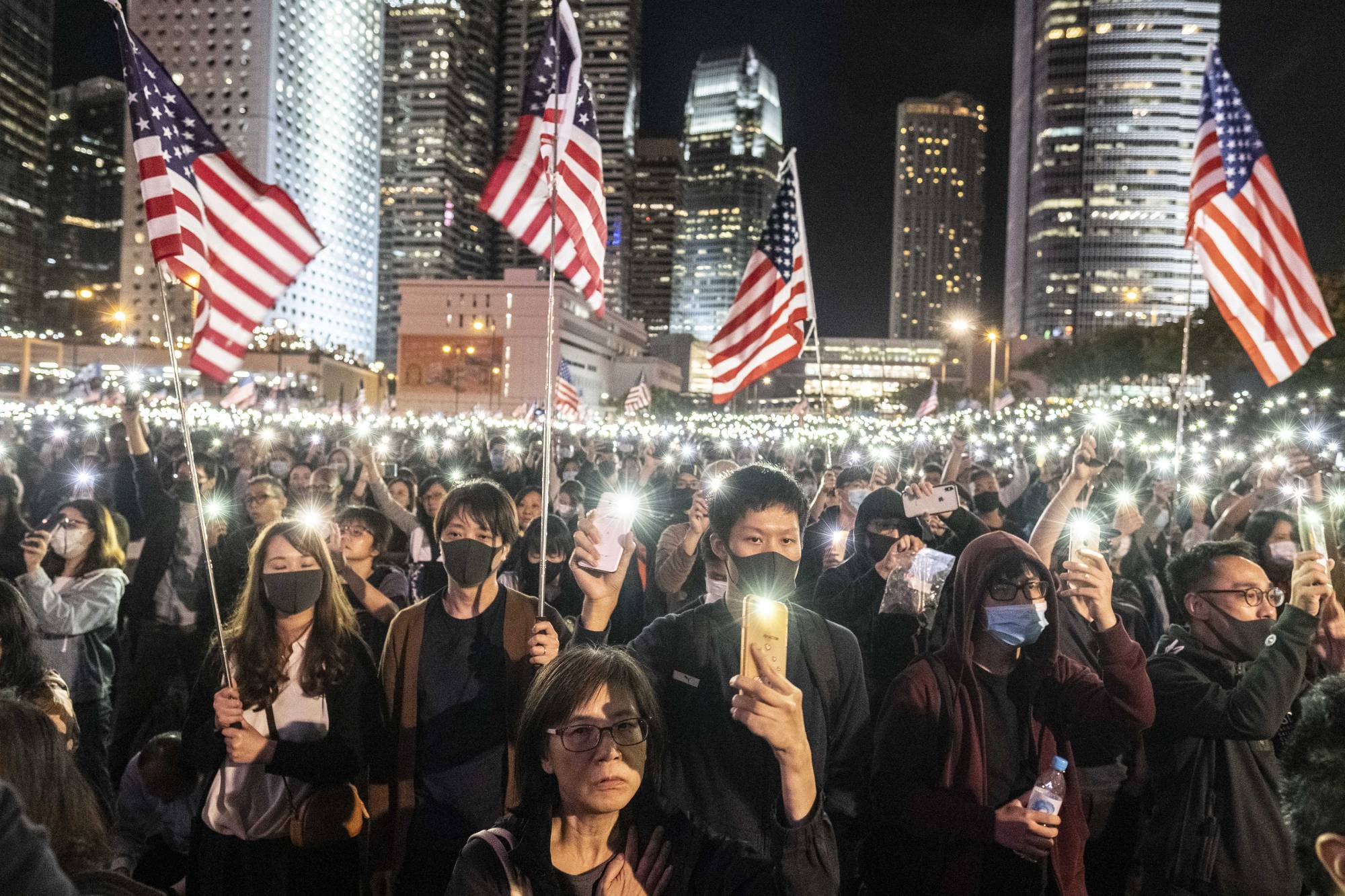 Protesters in Hong Kong gather in November 2019 to support legislation in the United States requiring American officials to assess Hong Kong’s autonomy from mainland China. | Lam Yik Fei / The New York Times