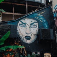 A street mural looks out at passers-by in the Harajuku neighborhood of Tokyo. | STEPHAN JARVIS
