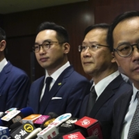 Lawmakers Dennis Kwok (left to right), Alvin Yeung, Kwok Ka-ki and Kenneth Leung give a news conference at the Legislative Council in Hong Kong on Wednesday. | AP
