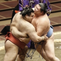 Shodai (right) competes against Takayasu during their bout at the November Grand Sumo Tournament on Tuesday at Ryogoku Kokugikan. | KYODO