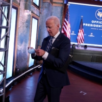 U.S. President-elect Joe Biden departs following a brief news conference at the theater serving as his transition headquarters in Wilmington, Delaware.  | REUTERS