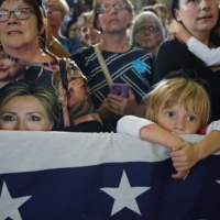 Supporters watch as Hillary Clinton gives a campaign speech in Akron, Ohio, on Oct. 3, 2016. | TODD HEISLER / THE NEW YORK TIMES