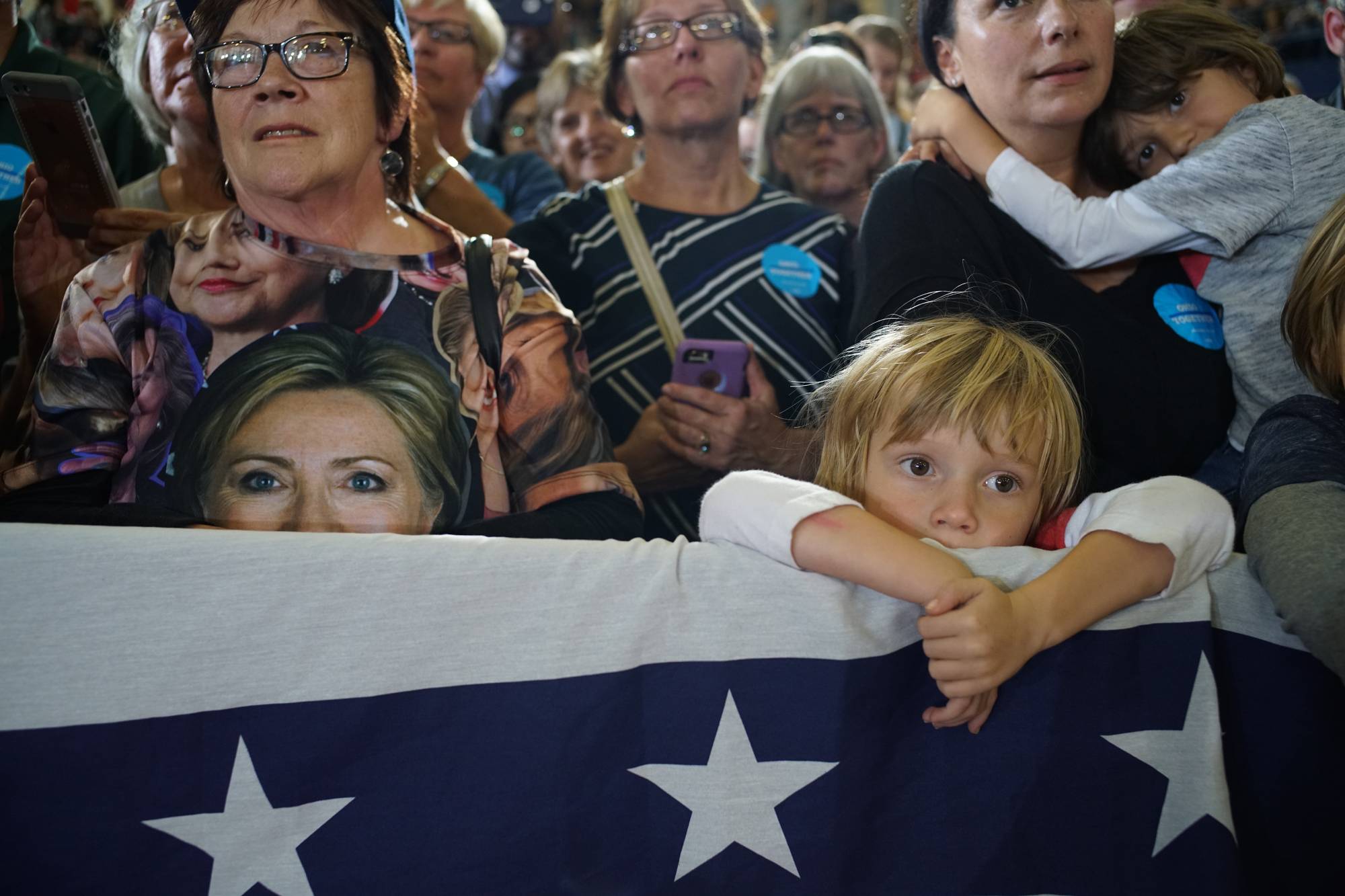 Supporters watch as Hillary Clinton gives a campaign speech in Akron, Ohio, on Oct. 3, 2016. | Todd Heisler / The New York Times