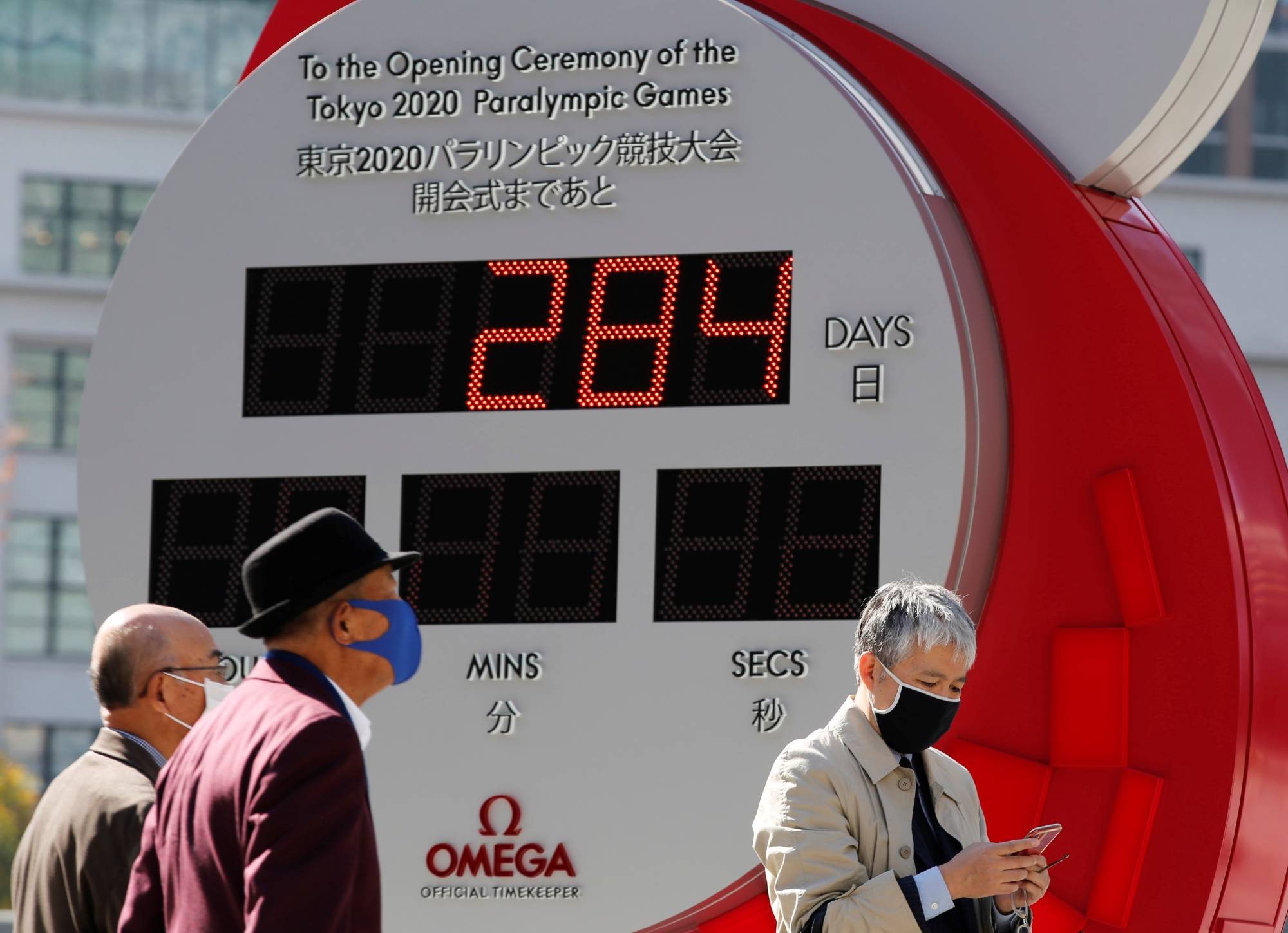 A clock in Tokyo counts down the days until the postponed Tokyo 2020 Paralympic Games on Friday. | REUTERS
