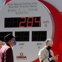 A clock in Tokyo counts down the days until the postponed Tokyo 2020 Paralympic Games on Friday. | REUTERS