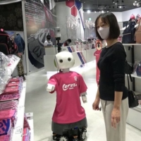 A robot capable of asking customers to wear masks at an Osaka store in October | KYODO