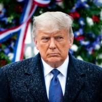 U.S. President Donald Trump visits Arlington National Cemetery for Veterans Day in Arlington, Virginia, on Wednesday. When he leaves the White House in January, Trump will be more vulnerable than ever to a pending grand jury investigation by the Manhattan district attorney into the president’s family business and its practices, as well as his taxes. | ERIN SCHAFF/THE NEW YORK TIMES