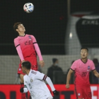 South Korea\'s Ju Se-jong (top) heads the ball past Mexico\'s Carlos Rodriguez during an international friendly on Saturday in Wiener Neustadt, Austria. | AP