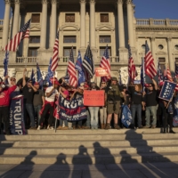Supporters of U.S. President Donald Trump gather at the Pennsylvania State Capital in Harrisburg, Pennsylvania, on Nov. 7. | VICTOR J. BLUE / THE NEW YORK TIMES