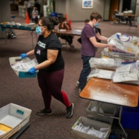 Election workers count ballots in Milwaukee, Wisconsin, on Nov. 3. | CHANG W. LEE / THE NEW YORK TIMES