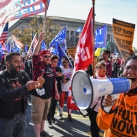 Supporters of President Donald Trump and counterprotesters stand off during a rally in support of the president near Freedom Plaza in Washington on Saturday. | KENNY HOLSTON / THE NEW YORK TIMES